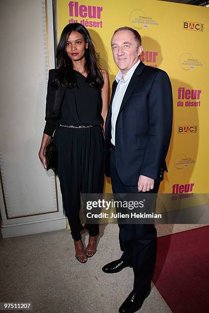 Liya Kebede and Francois-Henri Pinault attend the 'Fleur du Desert' Paris premiere at Theatre Marigny on March 7, 2010 in Paris, France.