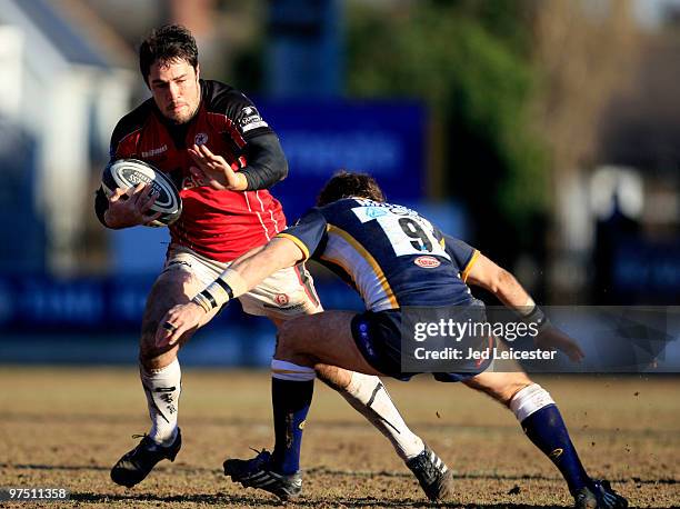 Brad Barritt of Saracens hands off Scott Mathie of Leeds Carnegie during the Guinness Premiership match between Leeds Carnegie and Saracens at...