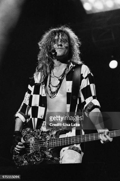 Rick Savage of Def Leppard performs on August 03, 1993 in Allentown, Pennsylvania.