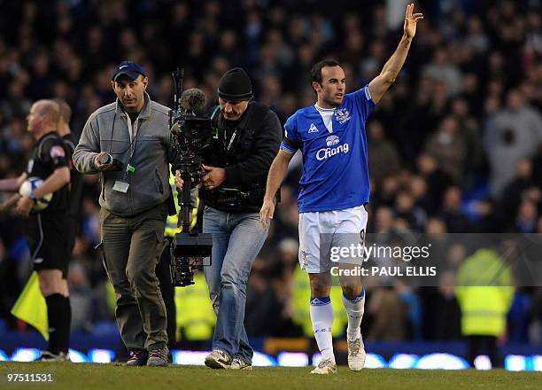 Everton's US forward Landon Donovan waves to the crowd after their English Premier League football match against Hull City at Goodison Park in...