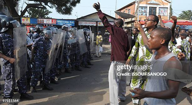 Togolese gendarmes and police forces prepare to charge supporters of Jean-Pierre Fabre, leader of the Union of Forces of Change , the main party of...