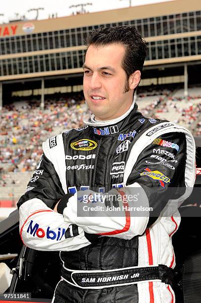 Sam Hornish Jr. , driver of the Mobil 1 Dodge, stands on the grid prior to the start of the NASCAR Sprint Cup Series Kobalt Tools 500 at Atlanta...