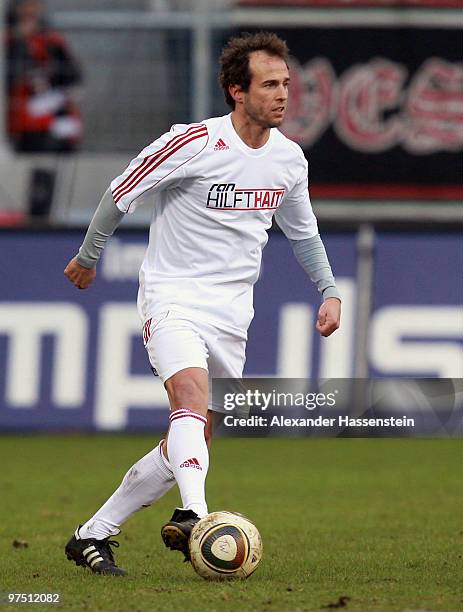 Mehmet Scholl of the ran AllstarTeam runs with the ball during the charity match for earthquake victims in Haiti between ran Allstart team and...