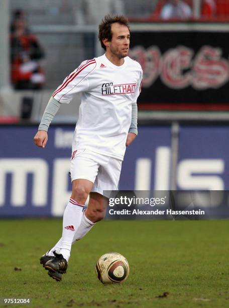 Mehmet Scholl of the ran AllstarTeam runs with the ball during the charity match for earthquake victims in Haiti between ran Allstart team and...