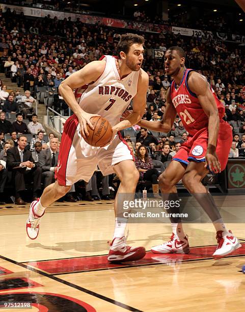 Andrea Bargnani of the Toronto Raptors drives baseline past Thaddeus Young of the Philadelphia 76ers during a game on March 07, 2010 at the Air...