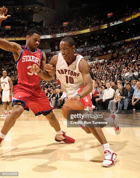 DeMar DeRozan of the Toronto Raptors dribbles past Willie Green of the Philadelphia 76ers during a game on March 07, 2010 at the Air Canada Centre in...