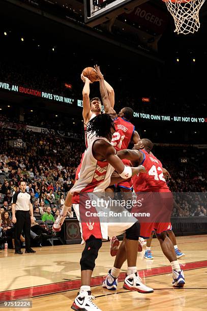 Andrea Bargnani of the Toronto Raptors just gets the shot over Thaddeus Young of the Philadelphia 76ers during a game on March 07, 2010 at the Air...