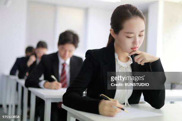 businesswoman taking exam - japan training session stock pictures, royalty-free photos & images