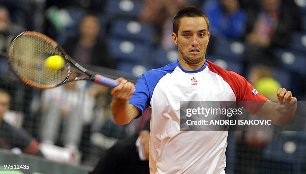 Serbia's Viktor Troicki returns the ball to Sam Querrey of the US during their Davis Cup World Group first round tennis match on March 7 in Belgrade...