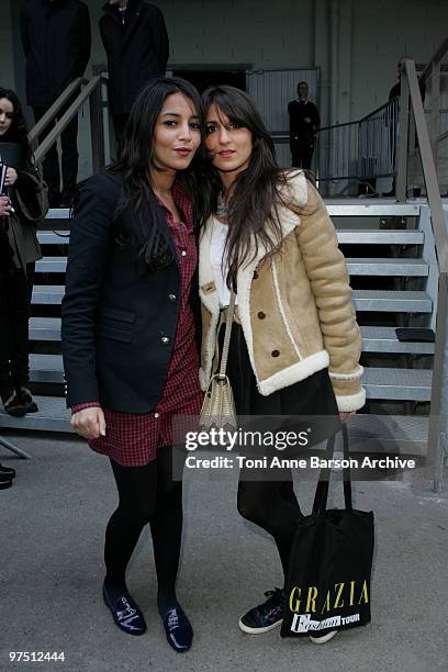 Leila Bekhti and a guest attend the John Galliano Ready to Wear show as part of the Paris Womenswear Fashion Week Fall/Winter 2011 at Halle...