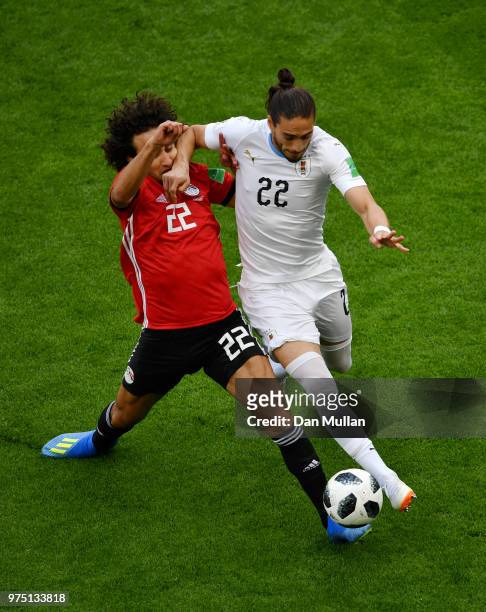 Amr Warda of Egypt and Martin Caceres of Uruguay battle for possession during the 2018 FIFA World Cup Russia group A match between Egypt and Uruguay...