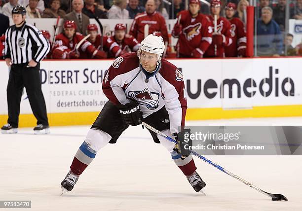 John-Michael Liles of the Colorado Avalanche skates with the puck during the NHL game against the Phoenix Coyotes at Jobing.com Arena on March 4,...