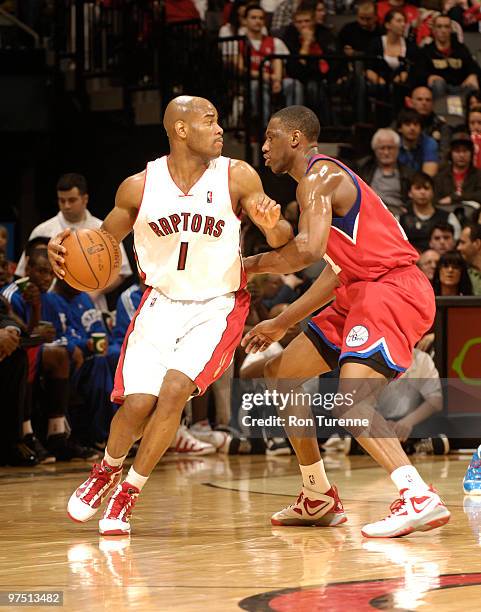 Jarrett Jack of the Toronto Raptors looks past the defense of Thaddeus Young of the Philadelphia 76ers during a game on March 07, 2010 at the Air...