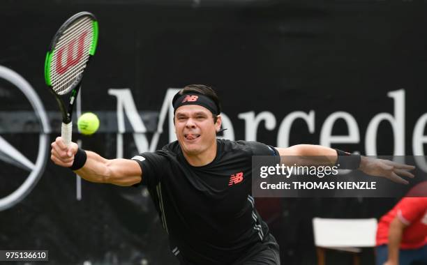 Canada's Milos Raonic returns the ball to the Czech Republic's Tomas Berdych in their quarter-final match at the ATP Mercedes Cup tennis tournament...