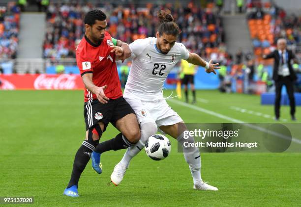 Ahmed Fathi of Egypt and Martin Caceres of Uruguay battle for the ball during the 2018 FIFA World Cup Russia group A match between Egypt and Uruguay...