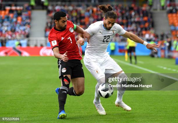 Ahmed Fathi of Egypt and Martin Caceres of Uruguay battle for the ball during the 2018 FIFA World Cup Russia group A match between Egypt and Uruguay...