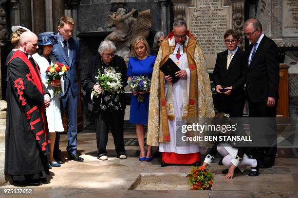 Dean of Westminster, John Hall , accompanied by first wife Jane Hawking and daughter Lucy Hawking , presides over the internment of the ashes of...