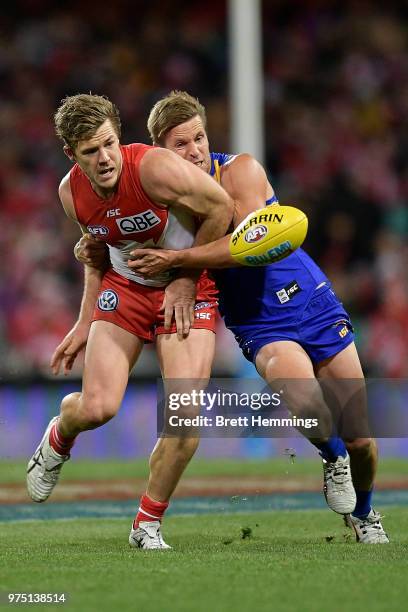Luke Parker of the Swans is tackled during the round 13 AFL match between the Sydney Swans and the West Coast Eagles at Sydney Cricket Ground on June...