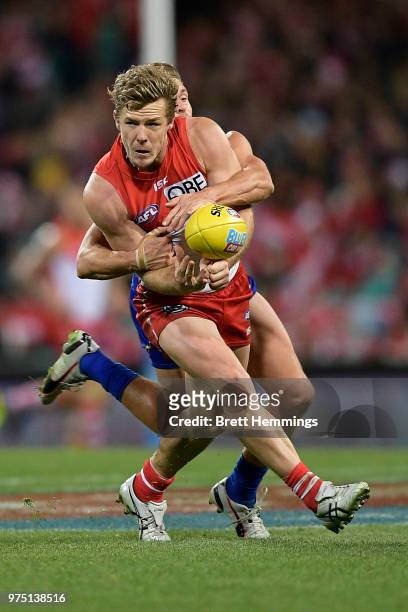 Luke Parker of the Swans is tackled during the round 13 AFL match between the Sydney Swans and the West Coast Eagles at Sydney Cricket Ground on June...