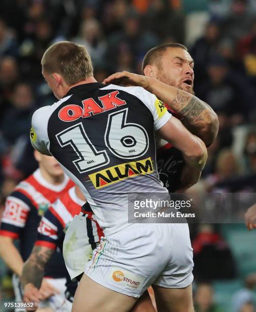 Jared Waerea-Hargreaves of the Roosters is tackled by Jack Hetherington of the Panthers during the round 15 NRL match between the Sydney Roosters and...