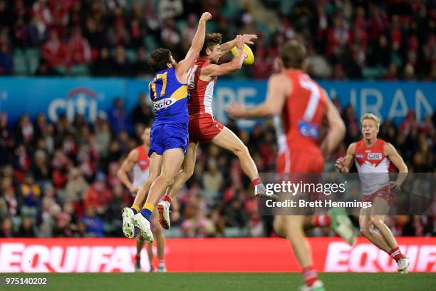Josh Kennedy of the Eagles spoils a mark by Dane Rampe of the Swans during the round 13 AFL match between the Sydney Swans and the West Coast Eagles...