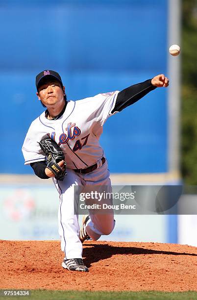 Relief pitcher Hisanori Takahashi of the New York Mets pitches against the Washington Nationals at Tradition Field on March 7, 2010 in Port St....