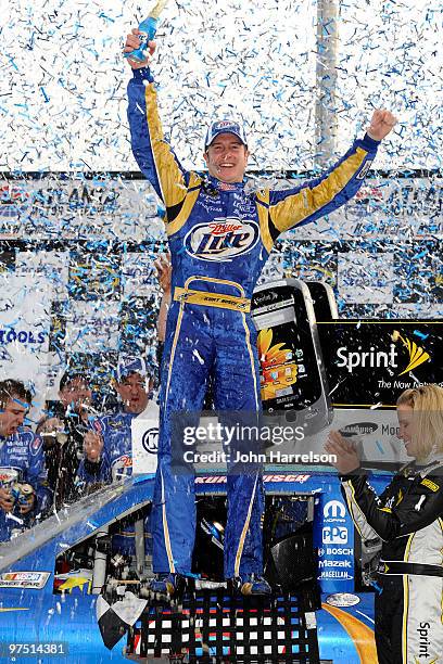 Kurt Busch, driver of the Miller Lite Dodge, celebrates in Victory Lane after winning the NASCAR Sprint Cup Series Kobalt Tools 500 at Atlanta Motor...