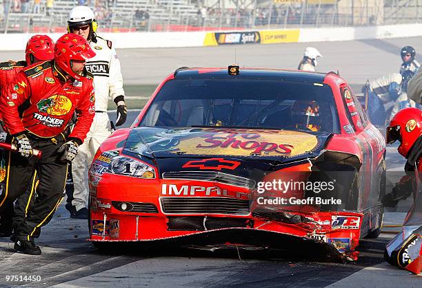 Jamie McMurray, driver of the Bass Pro Shops Chevrolet, sits on pit road after being involved in an incident on the track during the NASCAR Sprint...