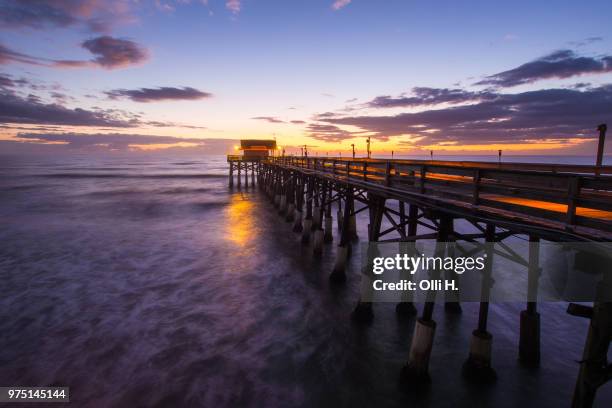 pier at sunrise in cocoa beach, brevard county, florida, usa - cocoa beach stock-fotos und bilder