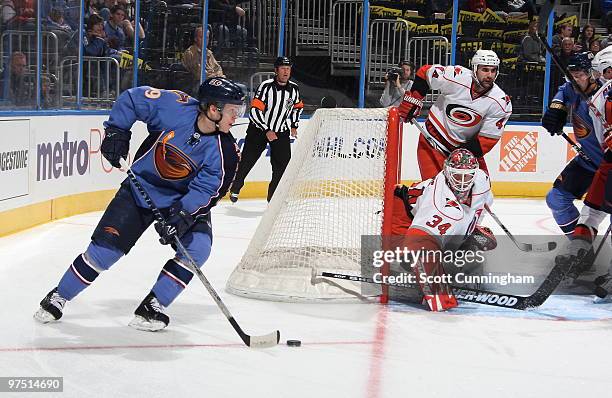 Tobias Enstrom of the Atlanta Thrashers carries the puck against the Carolina Hurricanes at Philips Arena on March 7, 2010 in Atlanta, Georgia.