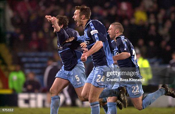 Paul McCarthy, Sam Parkin and Dannie Bulman of Wycombe Wanderers celebrate after their team's win the AXA sponsored FA Cup 5th round replay match...