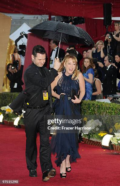 Actress Virginia Madsen arrives in the rain at the 82nd Annual Academy Awards held at Kodak Theatre on March 7, 2010 in Hollywood, California.