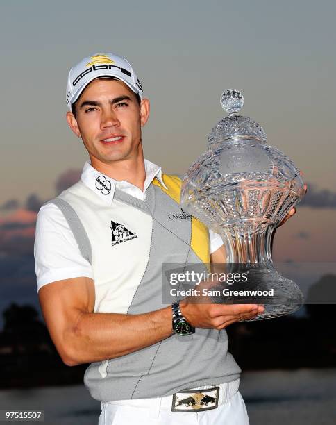 Camilo Villegas of Colombia poses with the trophy after winning the Honda Classic at PGA National Resort And Spa on March 7, 2010 in Palm Beach...