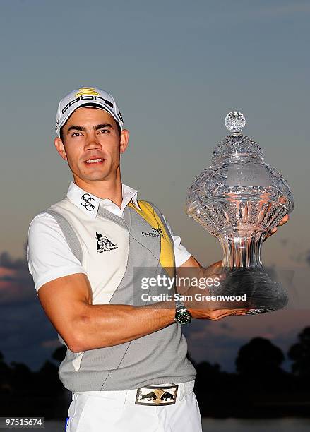 Camilo Villegas of Colombia poses with the trophy after winning the Honda Classic at PGA National Resort And Spa on March 7, 2010 in Palm Beach...