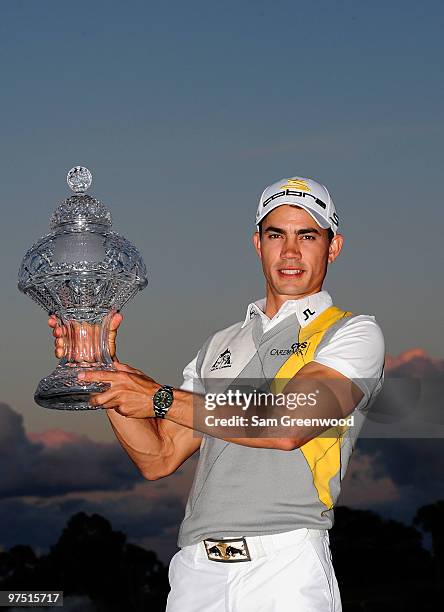 Camilo Villegas of Colombia poses with the trophy after winning the Honda Classic at PGA National Resort And Spa on March 7, 2010 in Palm Beach...