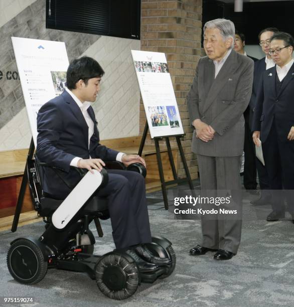 Japanese Emperor Akihito is briefed on an electric wheelchair at Hamano Products Co. In Tokyo's Sumida Ward on June 15, 2018. ==Kyodo