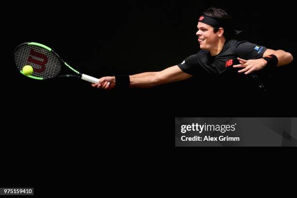 Milos Raonic of Canada returns the ball to Tomas Berdych of Czech Republic during day 5 of the Mercedes Cup at Tennisclub Weissenhof on June 15, 2018...