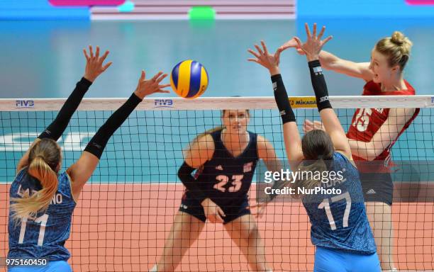 And KELSEY ROBINSON of USA in action against JULIETA CONSTANZA LAZCANO and HELENA VIDAL of Argentina during FIVB Volleyball Nations League match...