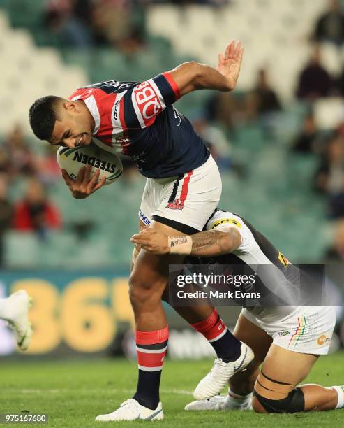 Daniel Tupou of the Roosters is tackled during the round 15 NRL match between the Sydney Roosters and the Penrith Panthers at Allianz Stadium on June...