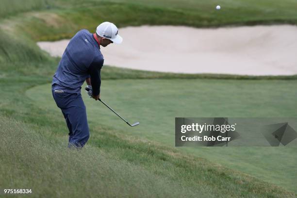 Aaron Wise of the United States chips to the 13th green during the second round of the 2018 U.S. Open at Shinnecock Hills Golf Club on June 15, 2018...