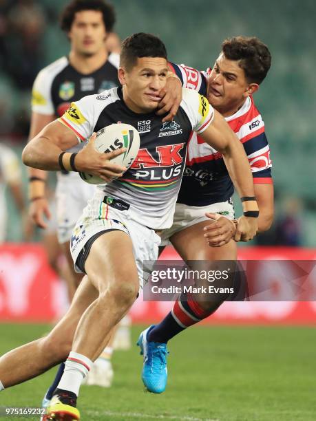 Dallin Watene-Zelezniak of the Panthers is tackled by Latrell Mitchell of the Roosters during the round 15 NRL match between the Sydney Roosters and...