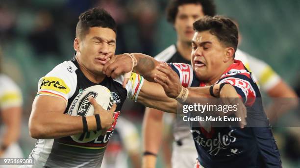 Dallin Watene-Zelezniak of the Panthers is tackled by Latrell Mitchell of the Roosters during the round 15 NRL match between the Sydney Roosters and...