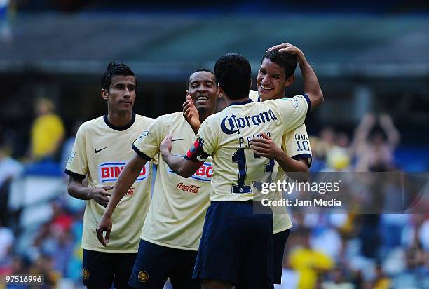 America's players Alonso Sandoval, Adolfo Rosinei, Pavel Pardo and Antonio Lopez celebrate a scored goal during their match against Queretaro as part...