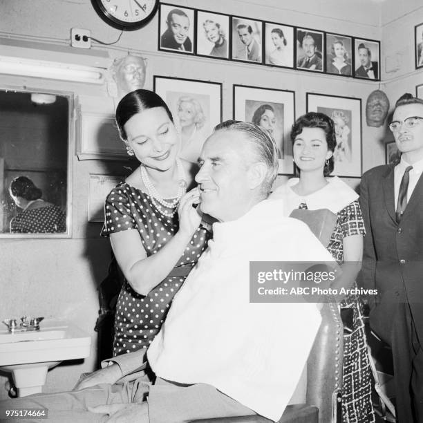 Ruth Hagy applying make-up to Governor of New York W Averell Harriman.