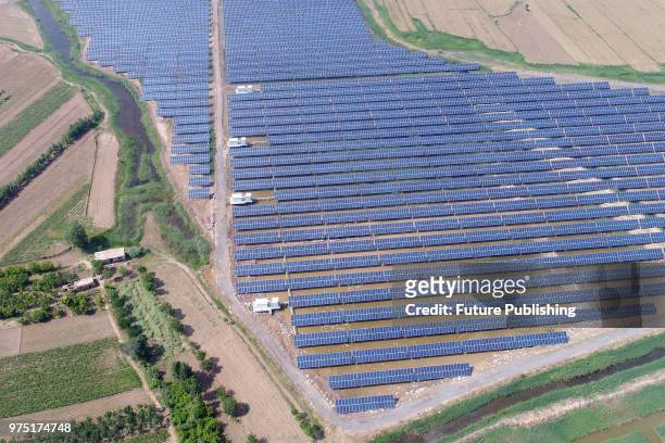 View of a solar station built in the ponds of a duck farm to maximize land usage in Binzhou in east China's Shandong province Thursday, June 14,...