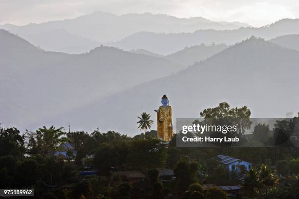 big buddha statue against the mountains in the golden triangle, kyaing tong, shan state, myanmar - buddha state stock pictures, royalty-free photos & images