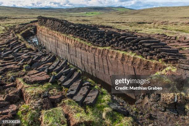 cut peat on a peat bog, yell, shetland islands, scotland, united kingdom - peat stock pictures, royalty-free photos & images