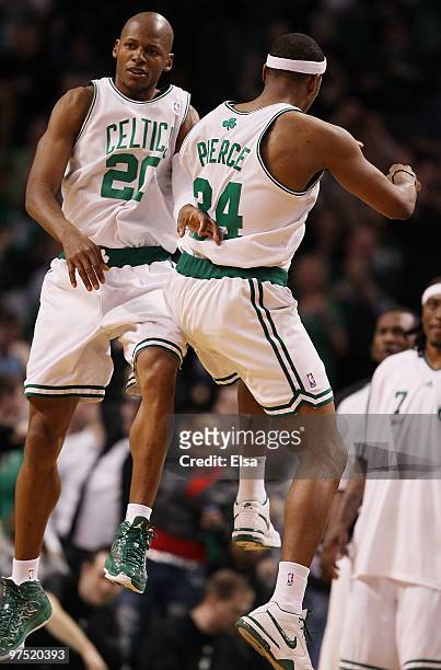 Ray Allen of the Boston Celtics celebrates his game winning three point shot with teammate Paul Pierce in the fourth quarter against the Washington...