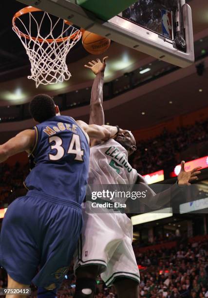 Kevin Garnett of the Boston Celtics is fouled by JaVale McGee of the Washington Wizards on March 7, 2010 at the TD Garden in Boston, Massachusetts....