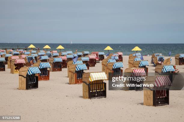 beach chairs on the sandy beach, travemuende, luebeck, schleswig-holstein, germany - travemuende stock pictures, royalty-free photos & images